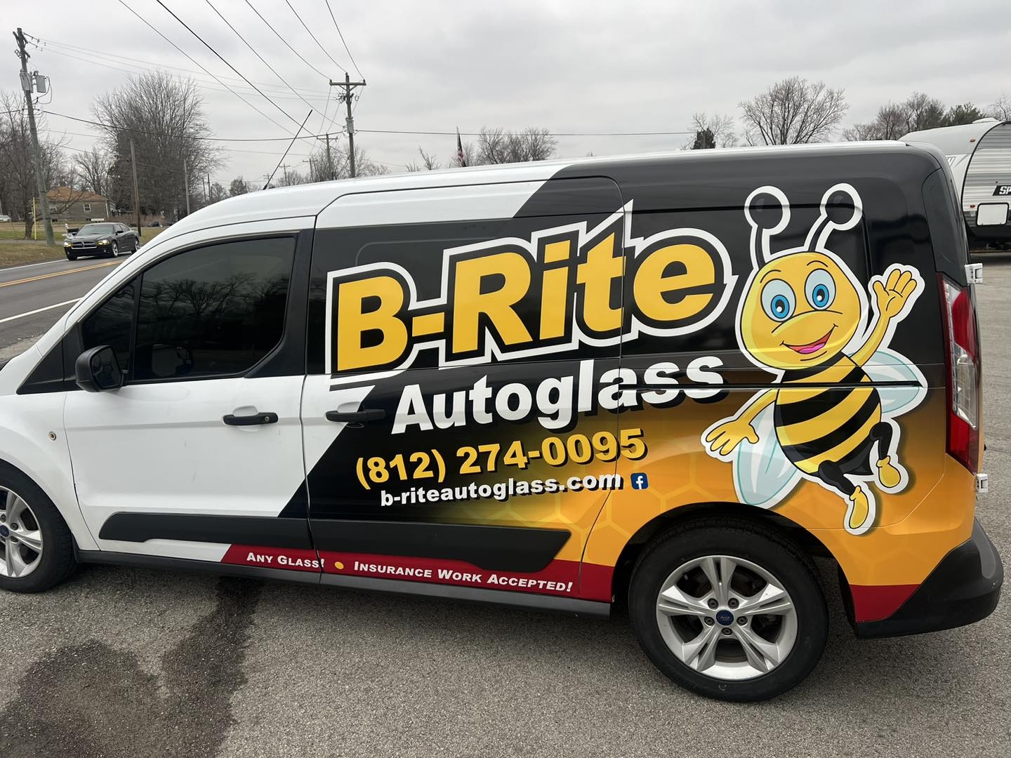 B-Rite Autoglass branded Ford Transit van with bee mascot and phone number
