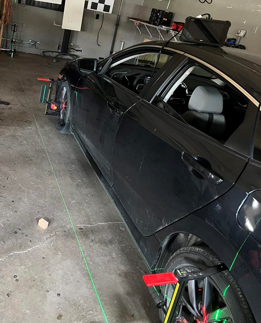 B-Rite Autoglass technician working on auto glass in the shop